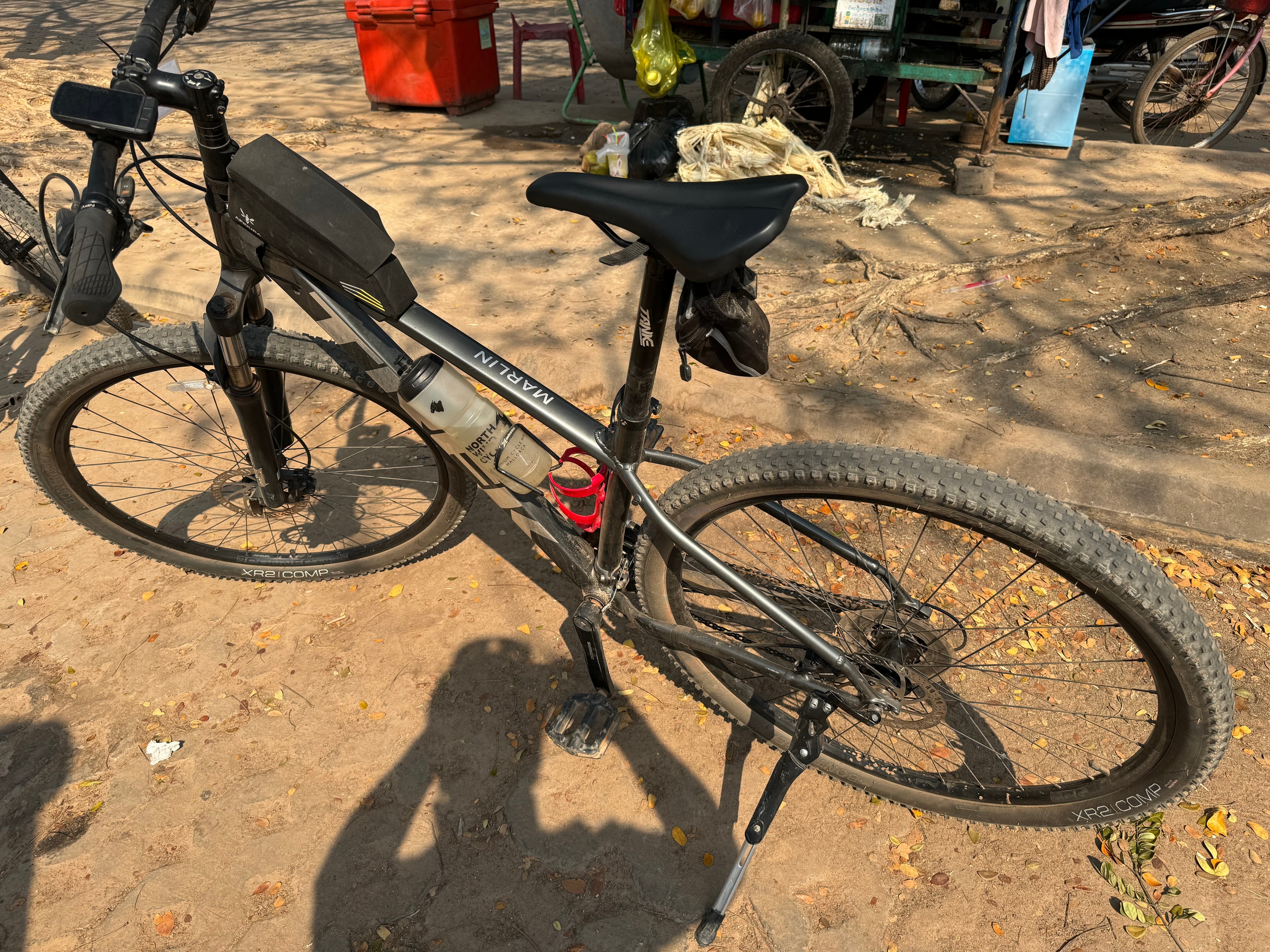Ho Chi Minh to Angkor Wat — mountain bike parked on dirt ground Cambodia